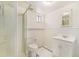 This bathroom features a convenient shower, toilet, sink, and storage cabinet at 3790 W 54Th Ave, Denver, CO 80221