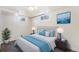 Comfortable bedroom with natural light, a plush bed, and stylish decor at 3790 W 54Th Ave, Denver, CO 80221