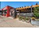 This Hops & Pie location features outdoor patio with seating, greenery, and a vibrant mural at 3790 W 54Th Ave, Denver, CO 80221