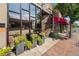 This Tatarain building features modern design, flower boxes, and a pink awning at 3790 W 54Th Ave, Denver, CO 80221