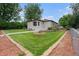 Charming single-story home with a well-maintained front yard and mature trees at 3790 W 54Th Ave, Denver, CO 80221