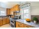 Well-appointed kitchen with stainless steel appliances, granite countertops, and ample storage at 3790 W 54Th Ave, Denver, CO 80221