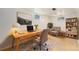 This home office offers a desk, chair, rug, bookcase, and natural light at 3790 W 54Th Ave, Denver, CO 80221