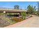 Scenic view of a creek flowing under a bridge, complemented by a paved walking path at 1335 S Holly St, Denver, CO 80222