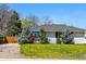 Well-maintained home with a lush front lawn and mature landscaping at 1335 S Holly St, Denver, CO 80222