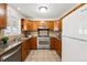 Kitchen with stainless steel appliances, granite countertops, and tile backsplash at 1335 S Holly St, Denver, CO 80222