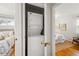 Convenient laundry closet featuring stacked washer and dryer inside the home at 1335 S Holly St, Denver, CO 80222