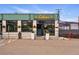 Charming restaurant exterior with large windows, decorative planters, and inviting entrance creating a welcoming atmosphere at 1335 S Holly St, Denver, CO 80222