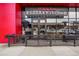 Contemporary restaurant with a modern facade, outdoor seating, and vibrant signage creating an inviting urban dining experience at 1335 S Holly St, Denver, CO 80222