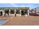 Storefront exterior with outdoor seating and planters near the entrance at 1335 S Holly St, Denver, CO 80222