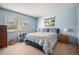 Carpeted bedroom with blue walls and a large window with natural light at 309 E Highline Cir # 102, Centennial, CO 80122