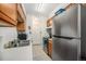 Bright kitchen featuring stainless steel appliances, white countertops and tile flooring at 309 E Highline Cir # 102, Centennial, CO 80122