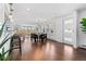 Open concept dining area with hardwood floors and modern table and chairs at 3470 W 42Nd Ave, Denver, CO 80211