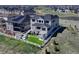 Aerial view of a two-story home with a large yard and outdoor entertaining area at 6860 S Yantley Ct, Aurora, CO 80016
