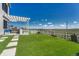Backyard features a patio area, green lawn, and a beautiful view at 6860 S Yantley Ct, Aurora, CO 80016