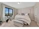 Bedroom featuring exercise bike, neutral colors and a large window view at 6860 S Yantley Ct, Aurora, CO 80016