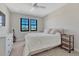 Bright bedroom with a ceiling fan, view, and neutral decor at 6860 S Yantley Ct, Aurora, CO 80016