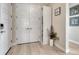 Welcoming entryway with hardwood floors, closet space, and contemporary design elements at 6860 S Yantley Ct, Aurora, CO 80016