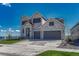 Beautiful two-story home with a stone facade, three gables, and a spacious three-car garage at 6860 S Yantley Ct, Aurora, CO 80016