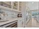 Bright kitchen boasting quartz countertops, decorative tile backsplash, and modern appliances with great natural light at 6860 S Yantley Ct, Aurora, CO 80016