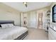 Bright bedroom with soft carpet and direct access to an en-suite bathroom and walk-in closets at 6860 S Yantley Ct, Aurora, CO 80016