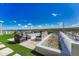 Outdoor patio area features stylish seating, a fire pit, and a water feature at 6860 S Yantley Ct, Aurora, CO 80016