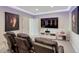 Home theater with reclining seats and a large flat screen television at 6860 S Yantley Ct, Aurora, CO 80016