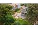 Aerial view of a landscaped backyard with a flagstone patio and mature trees at 8167 S Wabash Ct, Centennial, CO 80112