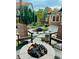 Landscaped backyard with a stone fire pit area perfect for outdoor gathering at 8167 S Wabash Ct, Centennial, CO 80112