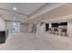 Finished basement with neutral carpeting and a custom bar area with seating at 8167 S Wabash Ct, Centennial, CO 80112