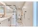 Well-lit bathroom with a glass-enclosed shower and modern fixtures at 8167 S Wabash Ct, Centennial, CO 80112
