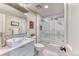Bathroom with a modern vanity, marble floors, and sliding glass shower door at 8167 S Wabash Ct, Centennial, CO 80112