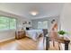 Bright bedroom with natural light, hardwood floors, and a quaint desk area at 8167 S Wabash Ct, Centennial, CO 80112