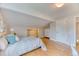 Cozy bedroom featuring a queen bed, hardwood floors, and neutral decor at 8167 S Wabash Ct, Centennial, CO 80112