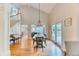 Open dining area featuring a staircase, bench, and door to the back yard at 8167 S Wabash Ct, Centennial, CO 80112