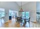 Dining area with vaulted ceilings, access to kitchen, and outdoor living space at 8167 S Wabash Ct, Centennial, CO 80112