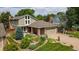 Inviting front yard featuring a well-maintained lawn and thoughtfully designed landscaping at 8167 S Wabash Ct, Centennial, CO 80112