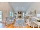 Bright living room with high ceilings, hardwood floors, and a cozy fireplace at 8167 S Wabash Ct, Centennial, CO 80112