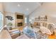 Cozy living room with modern decor, a fireplace, and a comfortable seating area at 8167 S Wabash Ct, Centennial, CO 80112