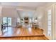 Open-concept living room featuring hardwood floors, fireplace, and access to the backyard at 8167 S Wabash Ct, Centennial, CO 80112