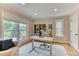 Bright home office with a large window, hardwood floors, and neutral decor at 8167 S Wabash Ct, Centennial, CO 80112