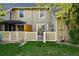 The back yard has a small lawn and patio with privacy fence at 2645 S Xanadu Way # C, Aurora, CO 80014