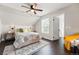 Comfortable bedroom with a ceiling fan, overhead lighting, natural light and elegant decor at 2645 S Xanadu Way # C, Aurora, CO 80014