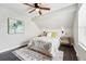 Comfortable bedroom with a ceiling fan, overhead lighting, natural light and elegant decor at 2645 S Xanadu Way # C, Aurora, CO 80014