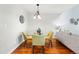 Dining room featuring a glass table and seating for four at 2645 S Xanadu Way # C, Aurora, CO 80014