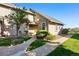 Exterior view of the townhome with a walkway to the front door and mature landscaping at 2645 S Xanadu Way # C, Aurora, CO 80014