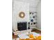 Close-up of the living room fireplace and built-in shelving at 2645 S Xanadu Way # C, Aurora, CO 80014