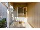 The home's front door has a screen door and is located under a covered porch at 2645 S Xanadu Way # C, Aurora, CO 80014