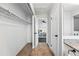 Hallway with access to the bedroom and bathroom, as well as closet space at 2645 S Xanadu Way # C, Aurora, CO 80014