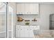Bright kitchen featuring sleek cabinets and an adjacent glass sliding door that lets in natural light at 2645 S Xanadu Way # C, Aurora, CO 80014